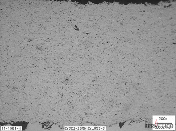 Close-up of a grainy gray surface with scattered small rocks.