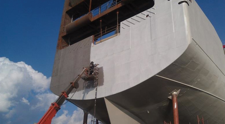 Arc spray coating applied to ship surface