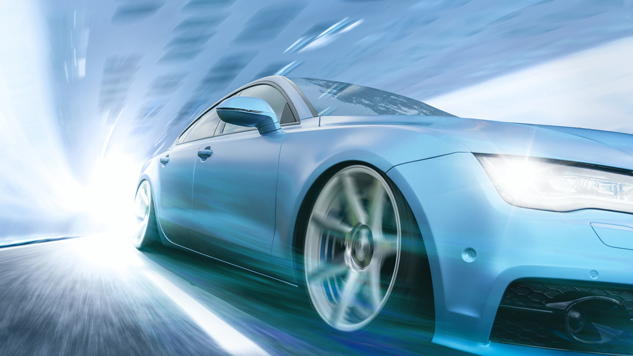 Blue sports car speeding through a bright tunnel with motion blur.