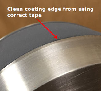 Close-up of a metal edge where the coating is clean thanks to using the correct tape.