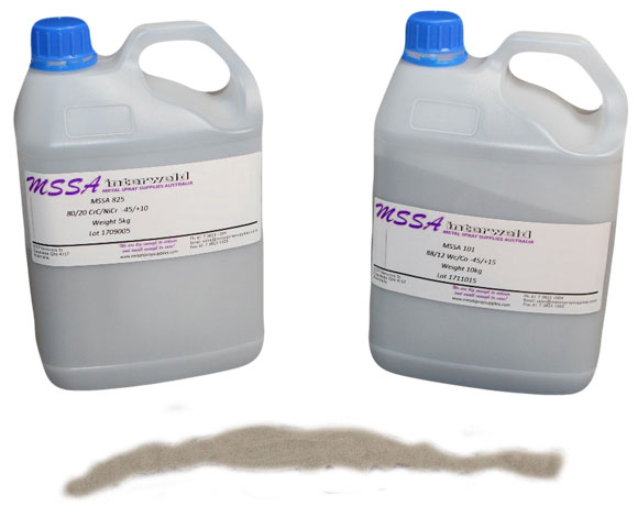 Two white plastic jugs with blue caps and purple labels sit on a surface with a brown liquid spill in front.