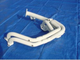 White curved plastic pipe fitting with an elbow joint and mounting bracket on a blue surface.