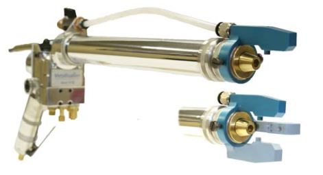 Long chrome cylinder with blue end fittings and attached tubing in an industrial fluid system.
