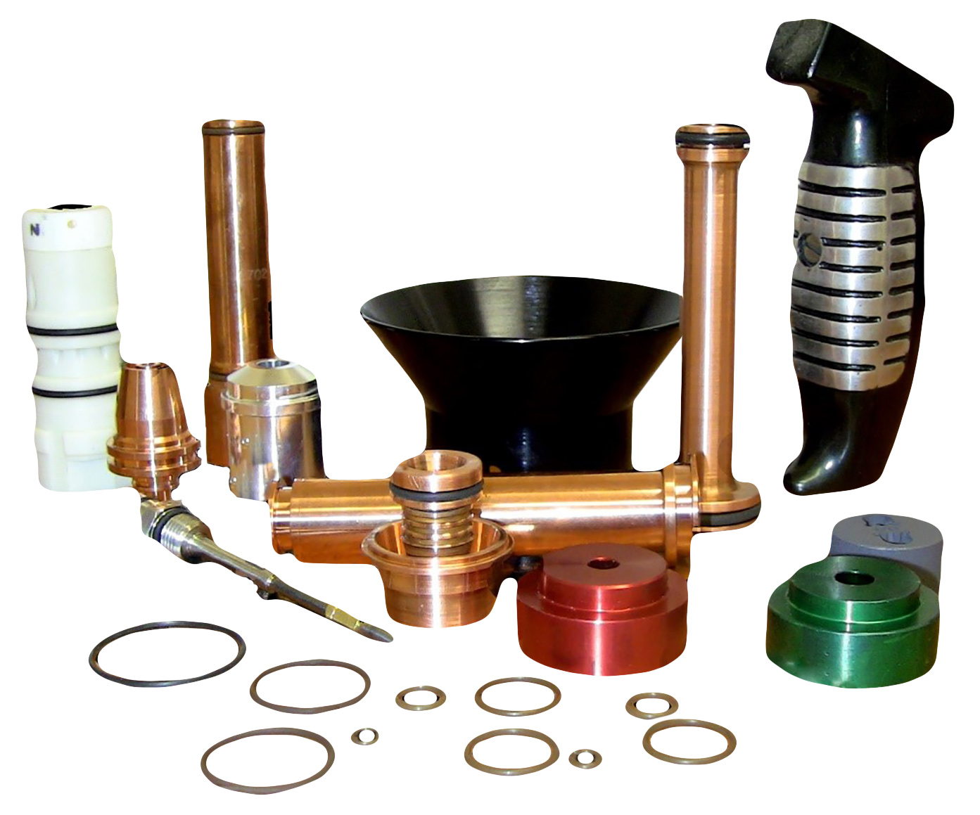 Assorted copper fittings, seals, gaskets, and O-rings arranged around a black bowl-shaped component.