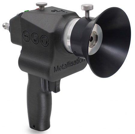 Handheld metallisation spray gun with a wide circular nozzle for applying metal coatings.