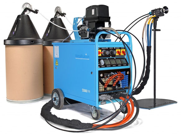 Blue portable industrial equipment with two tall brown filter canisters, orange hoses, and a spray gun on a stand.