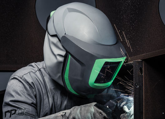 Worker wearing the RPB Z-Link respirator helmet during a spray operation