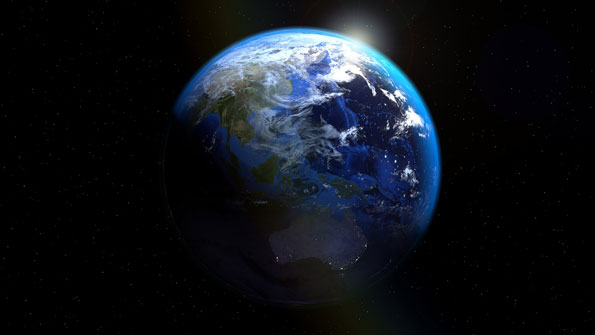 Earth seen from space, partially illuminated with visible landmasses and blue oceans against the dark backdrop of space.